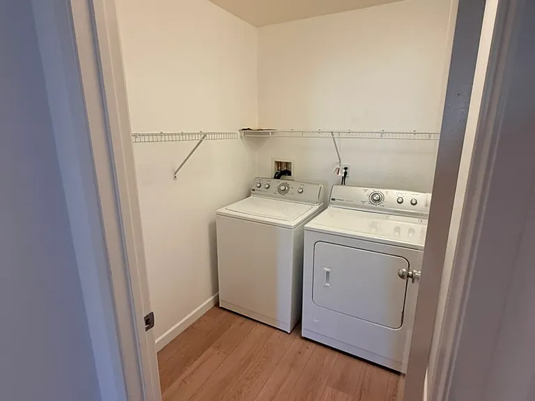 Laundry room includes washing machine and dryer, located on first floor.