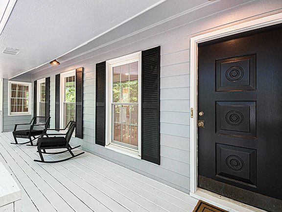 Large front porch in your private large lot