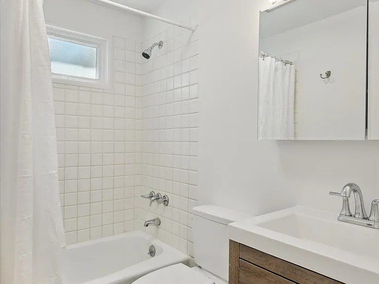 Extra Storage in the Main Floor Bath between the Drawers at the Vanity and the Medicine Cabinet