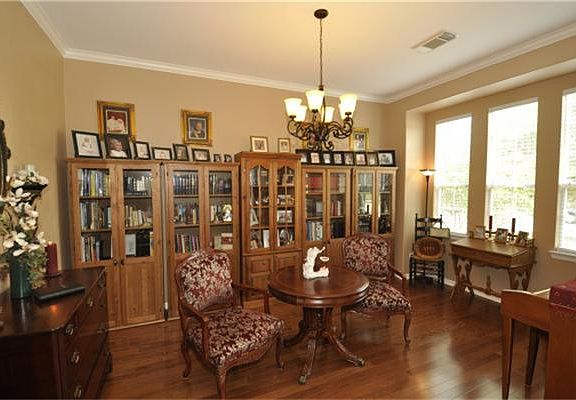 Formal living room with wood floors and lots of light