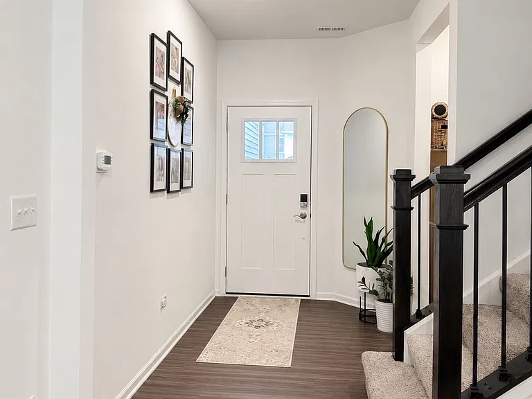 View from living room: Entry door and stairs