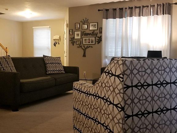 View from dining area into the living room and front entryway