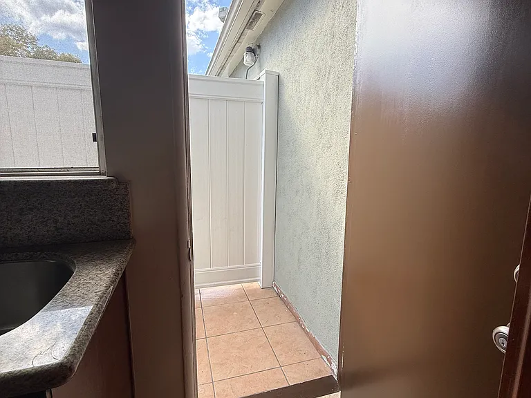 Kitchen leads to private sitting balcony