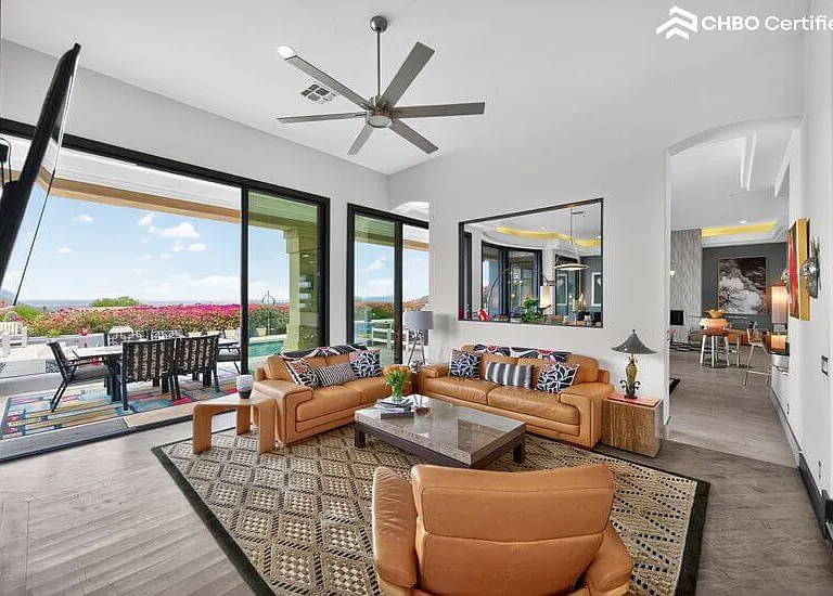 Sliding walls of glass to the resort style back yard