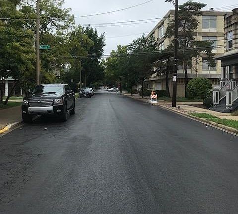 front view with brand new paved road