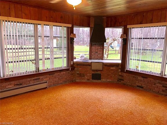FABULOUS 4-SEASON SUN ROOM, HEATED AND A/C. BUILT IN BBQ PIT. GORGEOUS WOOD CEILING AND BEAUTIFUL BRICK AROUND.