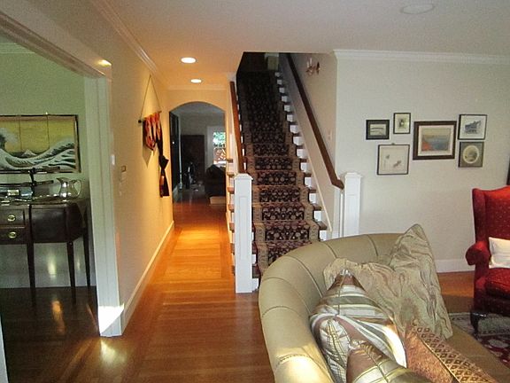 Hall to family room and stairs to upstairs