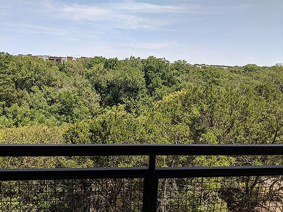 View of green belt from balcony