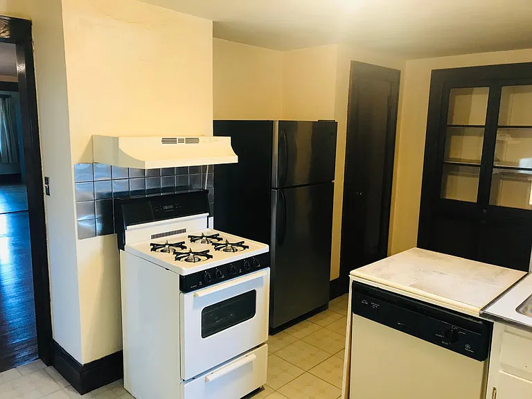 Angle view of Kitchen leading to pantry and then bathroom