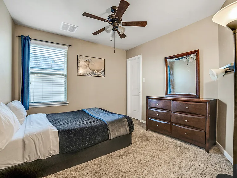 Upstairs guest bedroom with a walk-in closet