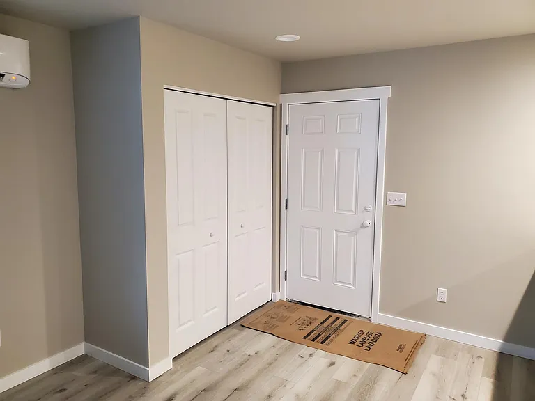 Closet just inside entry door....Split phase heater and AC upper left. Very quiet.