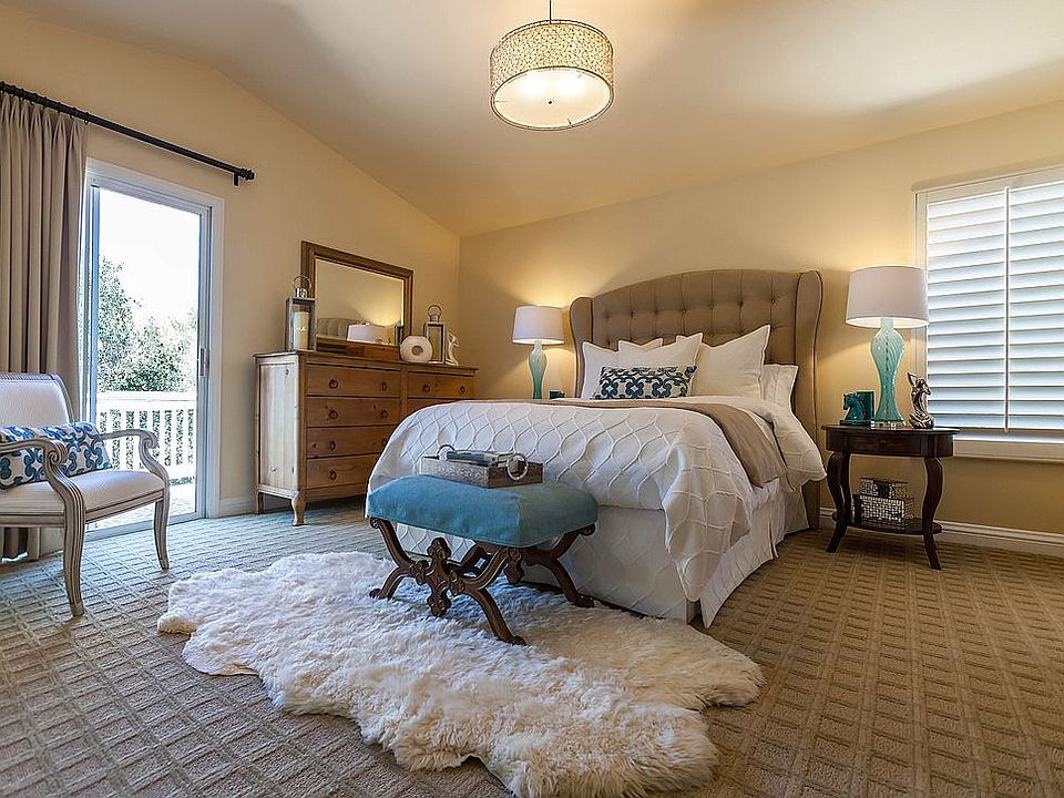 vaulted ceilings and balcony view