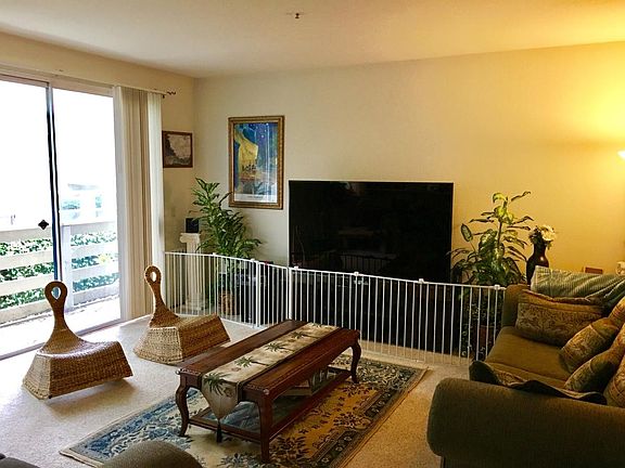 Large living room (shown furnished from earlier occupant. All furniture and objects now removed for future tenant)