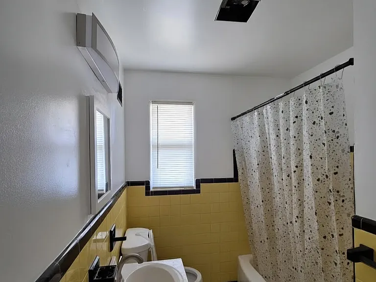 second bathroom with full tub