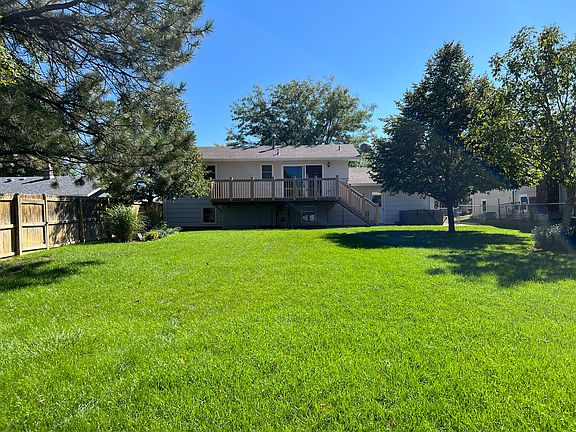 Beautifully cared for lawn, mature trees and large garden
