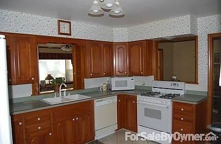 Kitchen : All cherry cabinets with gas stove, dishwasher, disposal and micwowave.