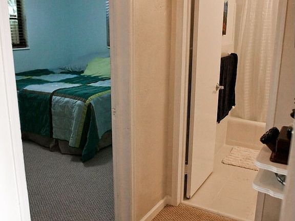 Hallway leads to Bathroom