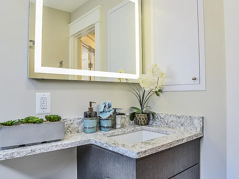 Cabinet built into wall. Large vanity w extended countertop