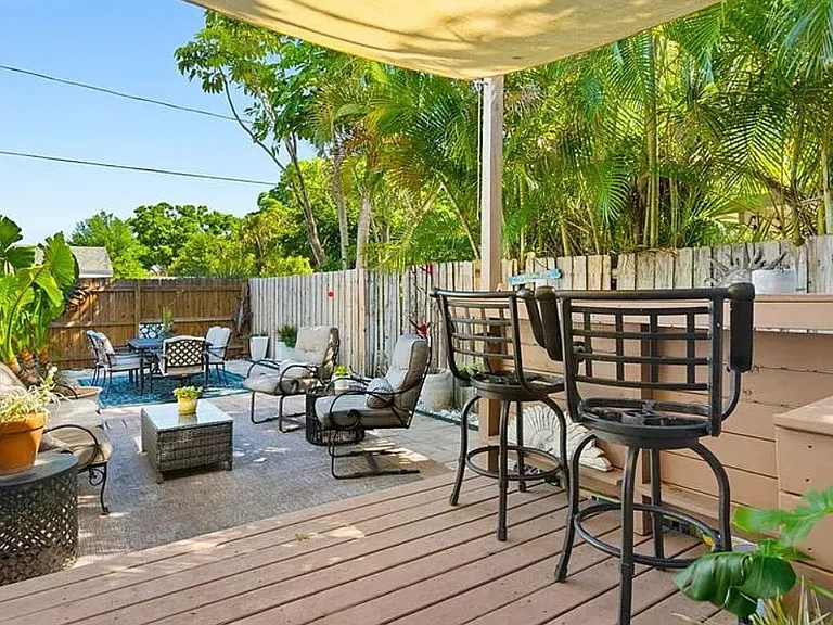 Backyard deck & patio with furniture (archival photo)