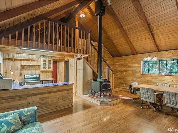 T&G Ceilings, wood wrapped walls, all open to the loft above. 