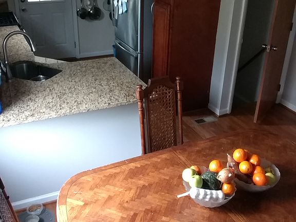 Dining/kitchen open area. Back door leads to sunroom