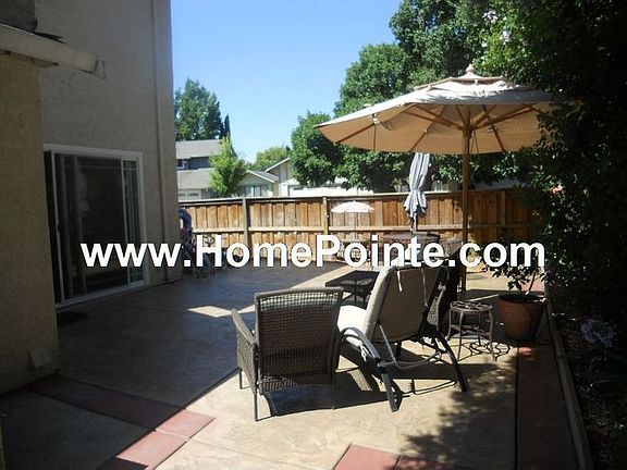 Private Rear Yard With Expansive Stamped Concrete