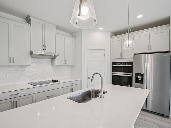 The Corsica Floorplan Kitchen at 462 Sun Chaser Drive.