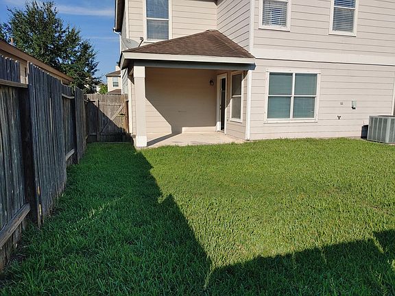 Back yard with patio and fenced.