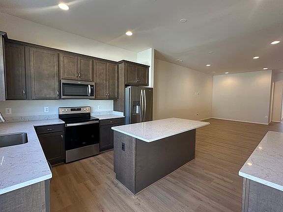 The kitchen in the Versailles on homesite 166 at The Crest at Linton Hall by Brookfield Residential