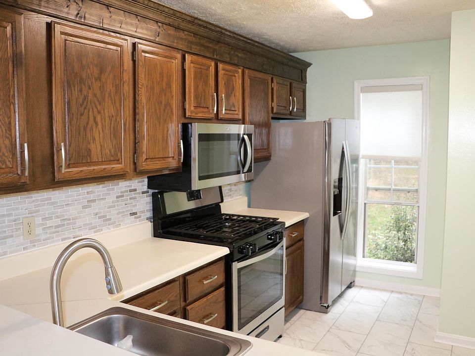 New appliances: microwave, gas stove, refrigerator, and dishwasher.