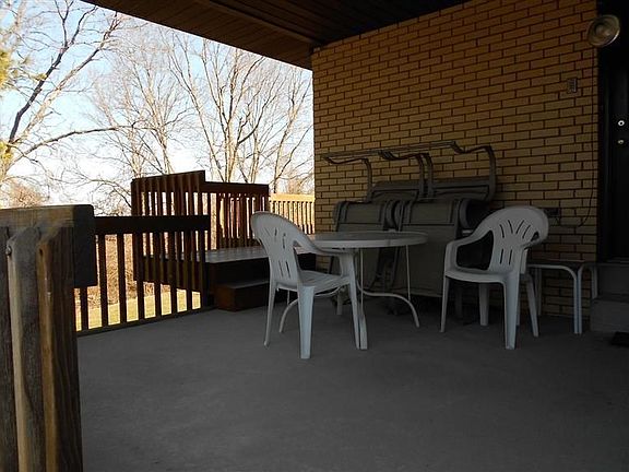 Side covered porch off the outside of the first floor laundry that walks into 