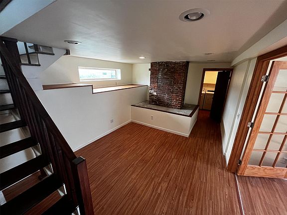 Downstairs living area; office on right