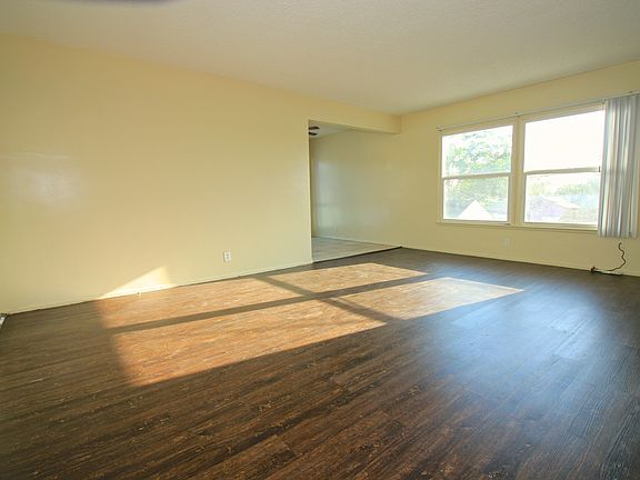 Living Room - looking toward dining room and large windows