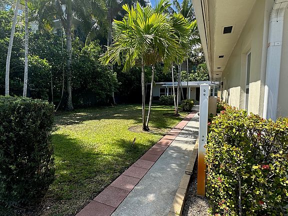 view from the front parking to the duplex in back of picture