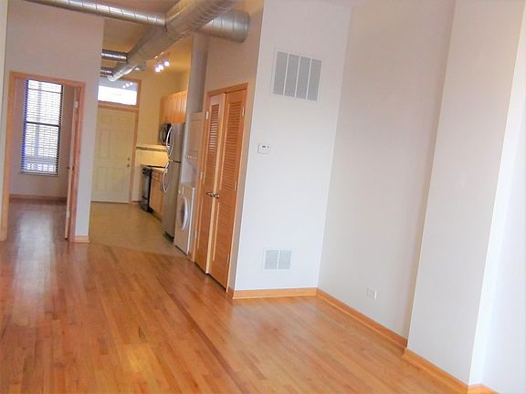 Living room viewing into the rear kitchen and door to the master bedroom