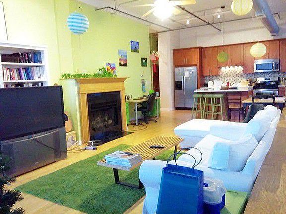 Light-filled living room with fire place