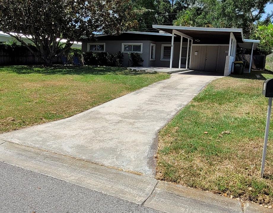 Front with large carport