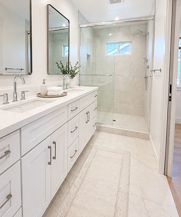 Luxurious primary bath with dual vanity and oversized walk-in shower