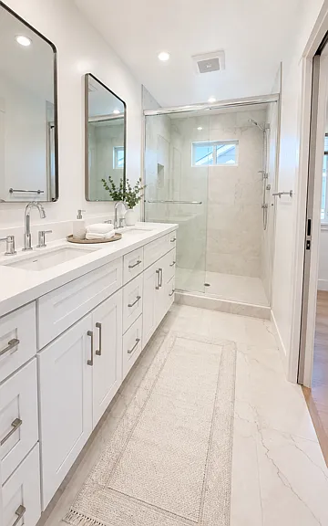 Luxurious primary bath with dual vanity and oversized walk-in shower