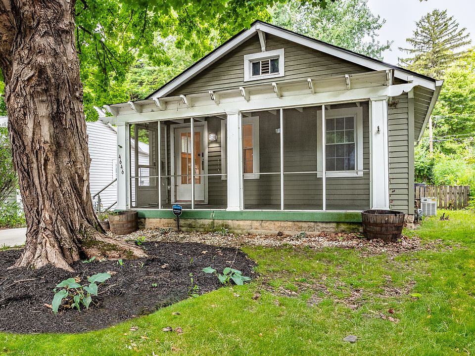 The screened-in porch on the front of the home faces East onto Rookwood Avenue
