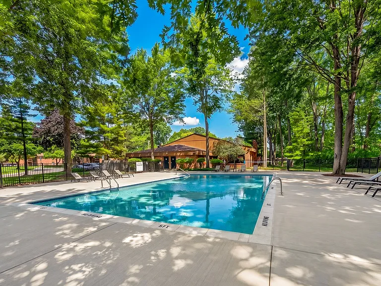 Heated swimming pool with sundeck at Eastwood Village Apartments in Clinton Township, MI.