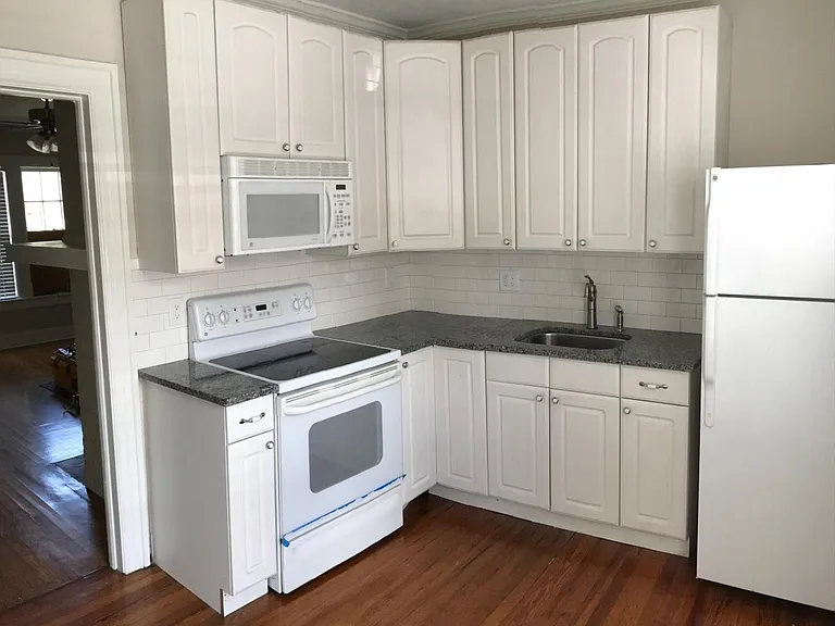 Kitchen with Granite and Subway Tile Backsplash (appliances have since been replaced with stainless steel)