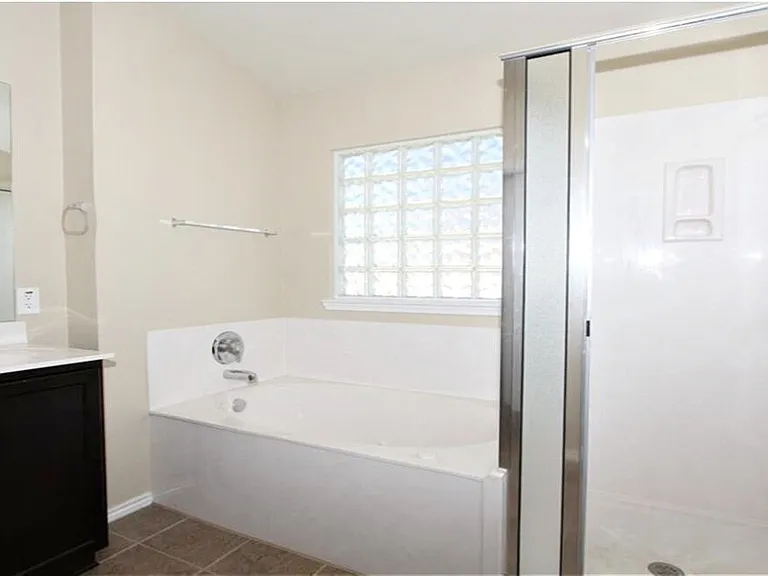 Master bathroom shower. soaking tub & dbl sinks.