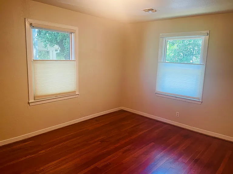 Another view of primary bedroom