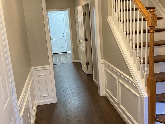 Front Entrance leading to Garage on left, bonus room, half bath, and laundry in far back. Stairs to 2ndFL