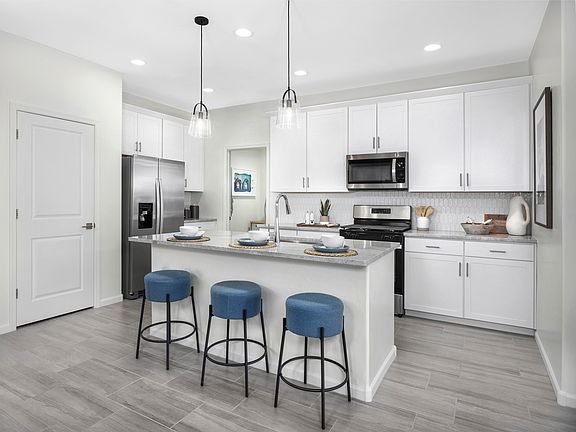 Enjoy breakfast at the eat-in kitchen island.
