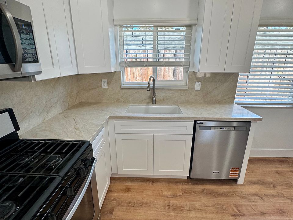 new kitchen and appliances, dishwasher, microwave, oven and refrigerator