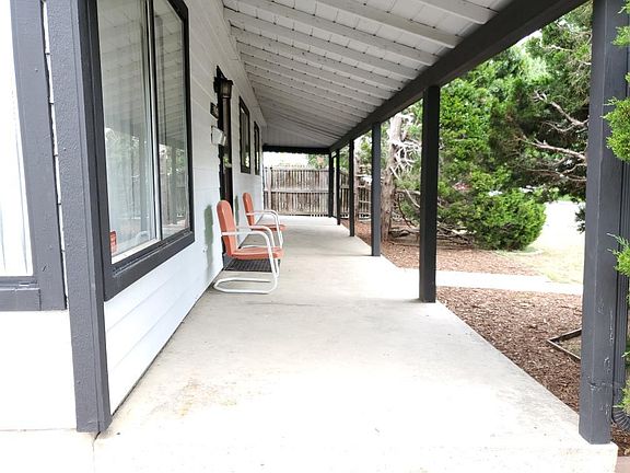 Beautiful front porch for relaxation and cool gatherings on warm evenings.