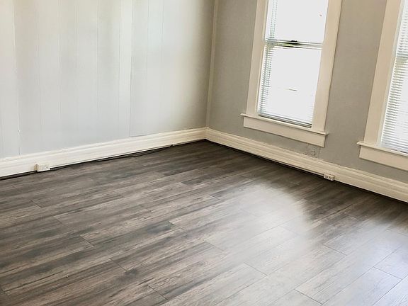 Spacious living room with new laminate wood floors