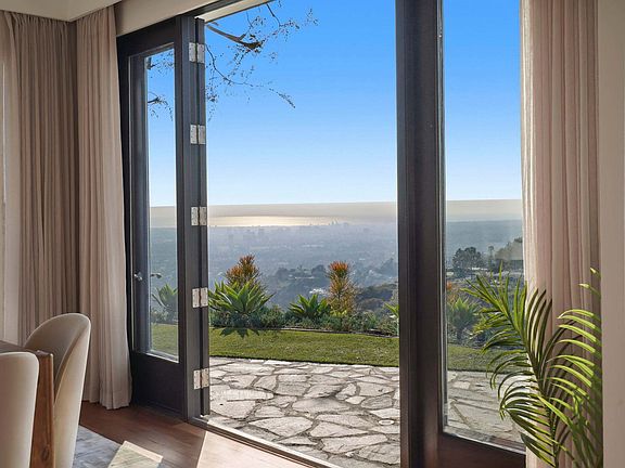 Sliding doors offer effortless access to the breathtaking outdoors.